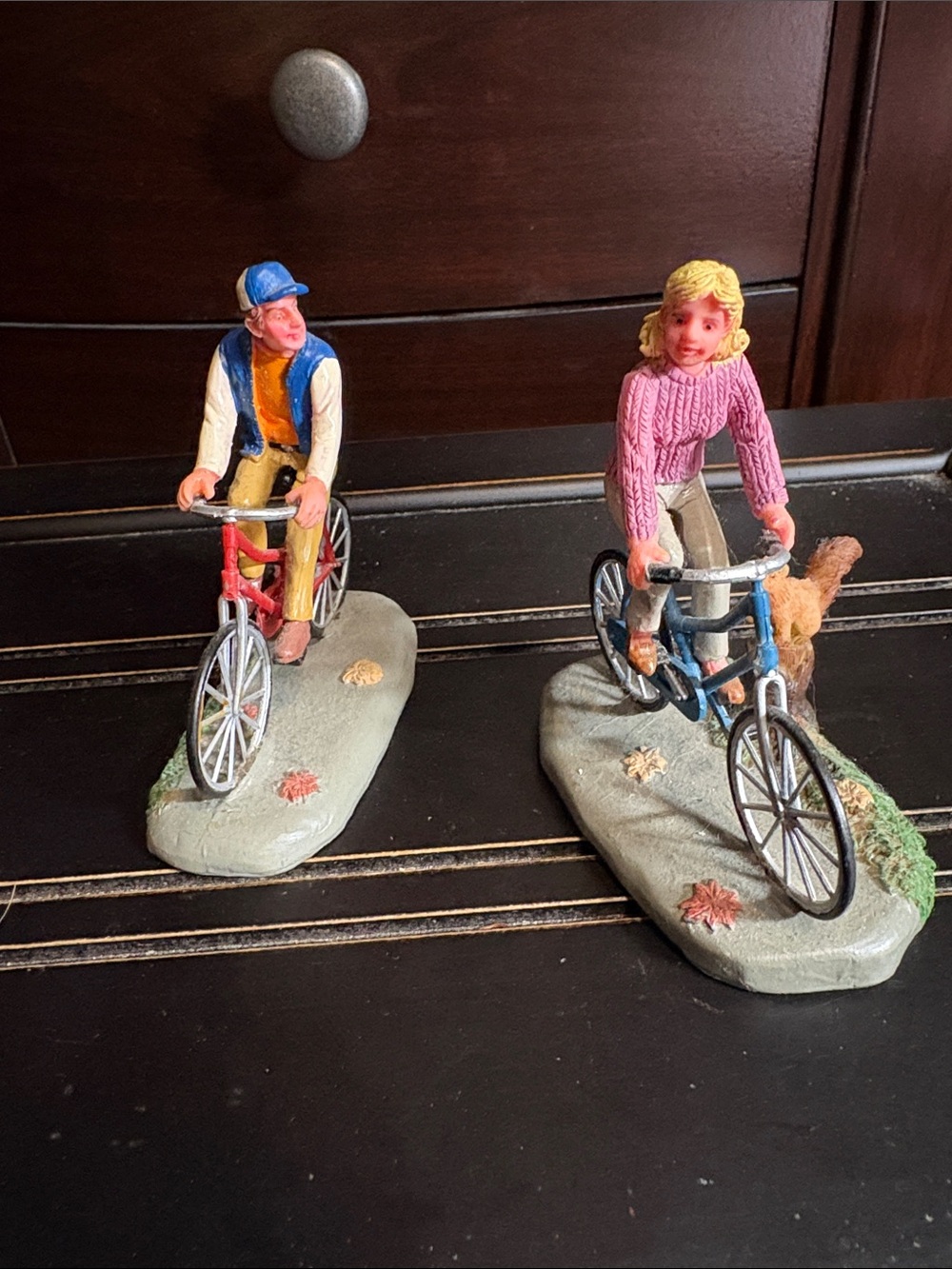 Lemax Hand-Painted Bicyclist Figurines- Pink Sweater Female & ball jacket male